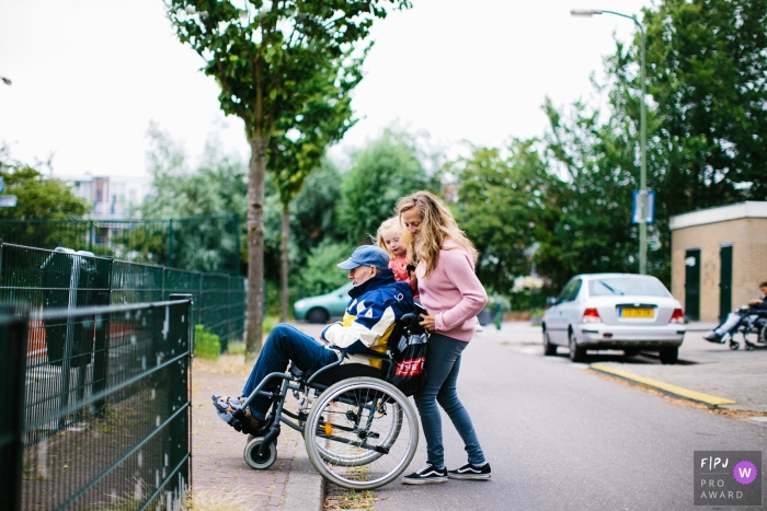Photo by: <a href="https://www.fpja.com/documentary-family-photography-contests/jolanda-boer/drenthe/2109993">Jolanda Boer - Netherlands</a> NL documentary-style family photo shoot from the streets showing the Taking care of grandfather with the family in Drenthe