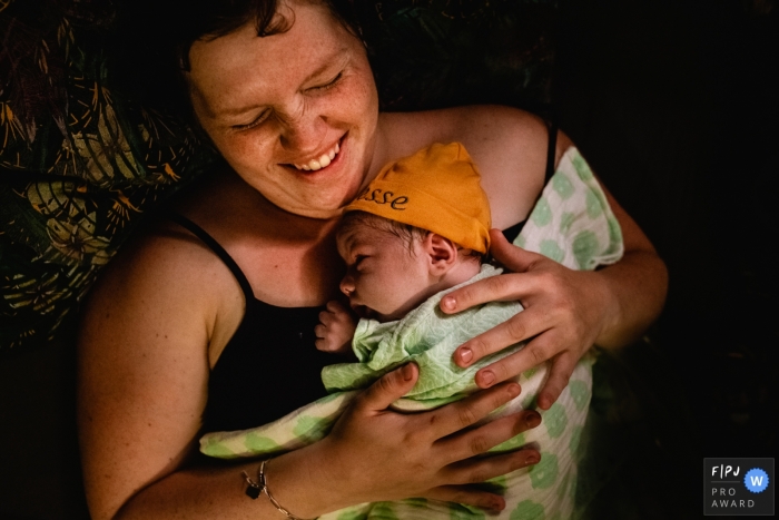 Groningen at home birth photo session in a documentary-style showing first moments with her baby after a home birth