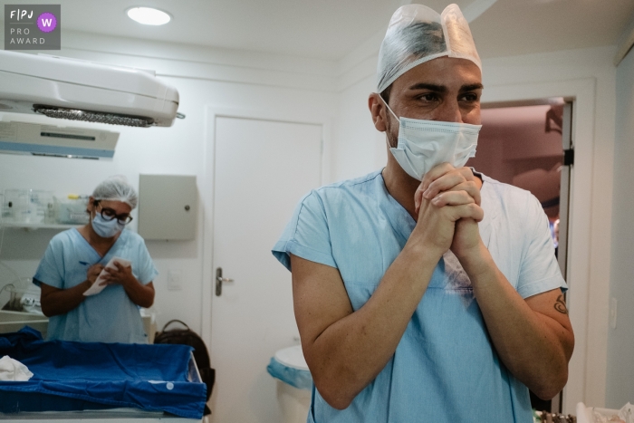 Photo by: <a href="https://www.fpja.com/documentary-family-photography-contests/thiago-braga/florianopolis/2111697">Thiago Braga - Brazil</a> Florianopolis hospital documentary birth photography showing the Father is thrilling, right after the birth of his daughter.