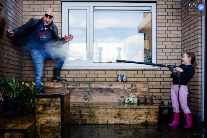 Photo by: <a href="https://www.fpja.com/documentary-family-photography-contests/gaby-ermstrang/noord-brabant/2110448">Gaby Ermstrang - Netherlands</a> Day in the Life Noord Brabant documentary family photography session with a Playful water blaster