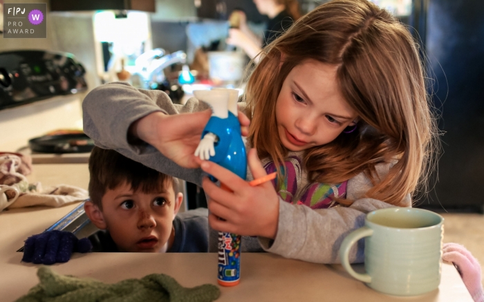 San Francisco Day in the Life Session of documentary family photography showing the navigating of an m&m dispenser