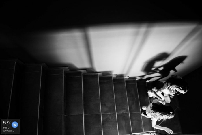 PACA at home Day in the Life photography of kids in BW racing down the stairs PACA at home Day in the Life photography of kids in BW racing down the stairs