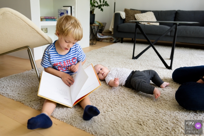 Photo by: <a href="https://www.fpja.com/documentary-family-photography-contests/ingeborg-van-bruggen/zuid-holland/2110884">Ingeborg van Bruggen - Netherlands</a> Netherlands Day in the Life Session of documentary family photography during the Reading time with sister