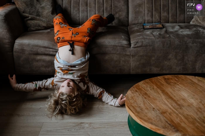 South Holland at home Day in the Life photography of a kid Just hanging out on the couch South Holland at home Day in the Life photography of a kid Just hanging out on the couch