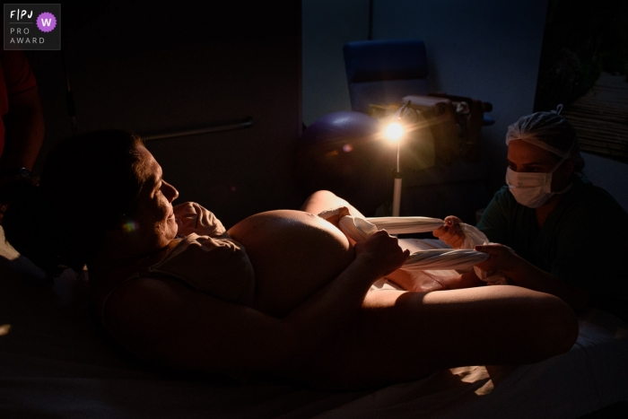 Moment driven Sinhá Junqueira Hospital Maternidade birth photojournalism image capturing the moment of labor and birth Moment driven Sinhá Junqueira Hospital Maternidade birth photojournalism image capturing the moment of labor and birth