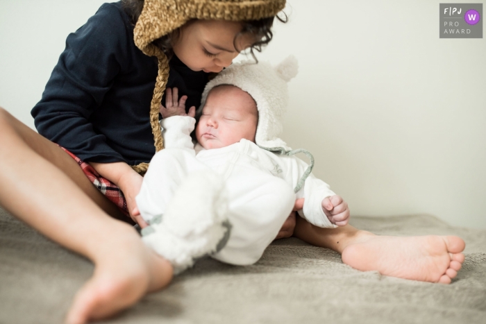Photo by: <a href="https://www.fpja.com/documentary-family-photography-contests/chrystel-echavidre/landes/2111922">Chrystel Echavidre - France</a> Moment-driven Landes family photography capturing brother and sister hanging together