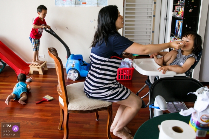 Moment driven Chicago family photojournalism image covering the realities of daily life