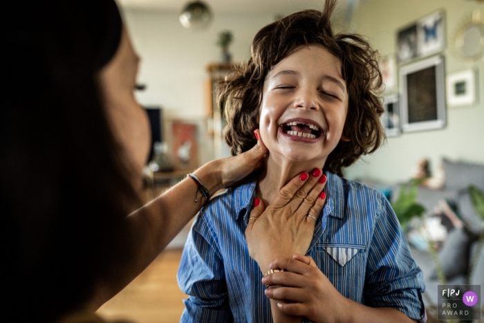 Photo by: <a href="https://www.fpja.com/documentary-family-photography-contests/polina-subbotina/hamburg/2112137">Polina Subbotina - Germany</a> Moment-driven Hamburg family photography capturing a mother applying sunscreen to her child