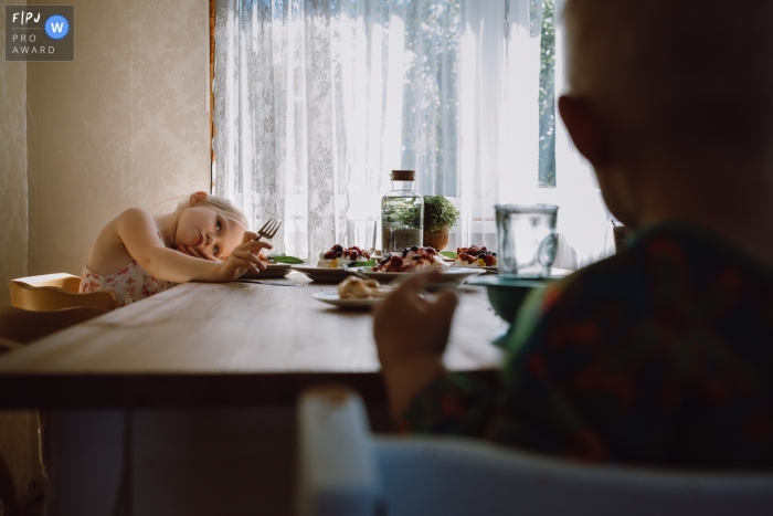 Moment-driven Tallinn family Day in the Life photography at home showing a moment while child eat a cake Moment-driven Tallinn family Day in the Life photography at home showing a moment while child eat a cake