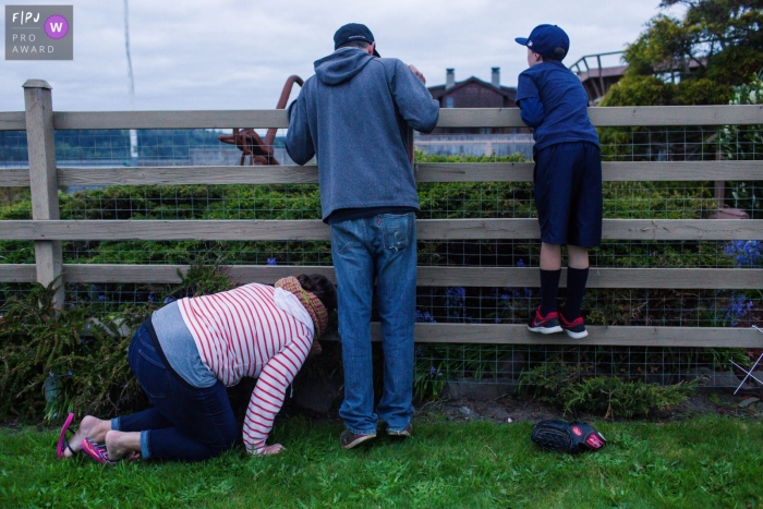 Moment-driven Bay Area, CA family photography of the ball over the fence