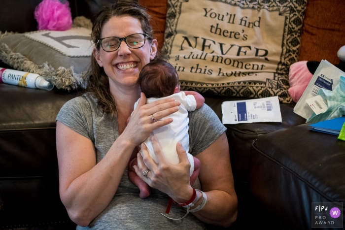 Moment driven Connecticut family photojournalism image showing That pillow is truth. There's never a dull moment!