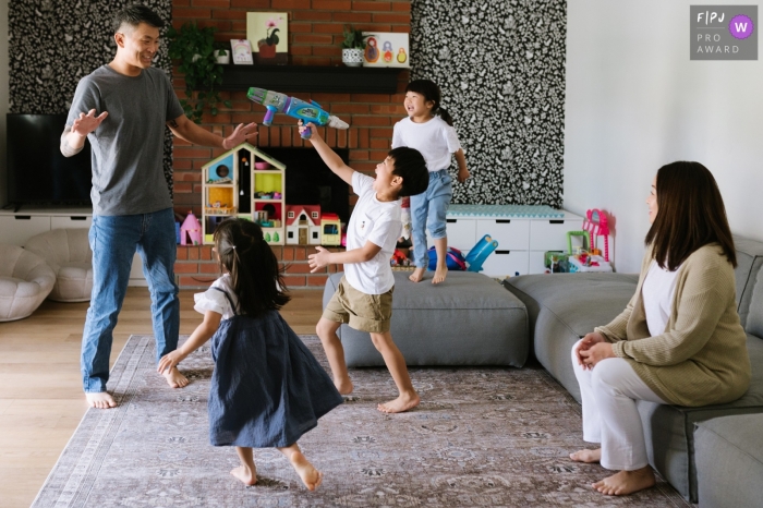 Moment-driven Los Angeles family photography showing an Asian family playing in the playroom