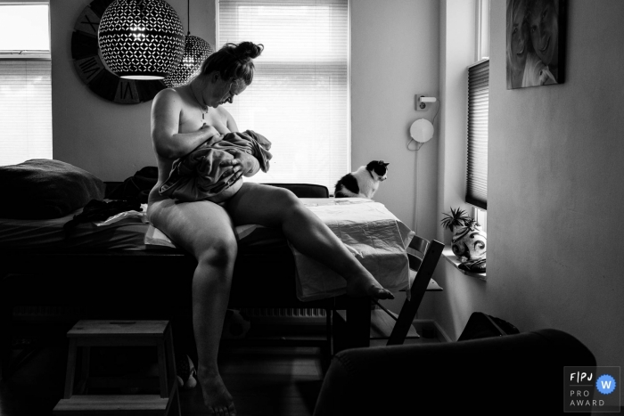 Groningen mother as a special moment together with her newborn infant during this home birth photo shoot Groningen mother as a special moment together with her newborn infant during this home birth photo shoot