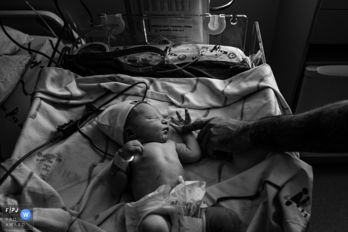 Sao Paulo father giving support for his baby right after birth Sao Paulo father giving support for his baby right after birth