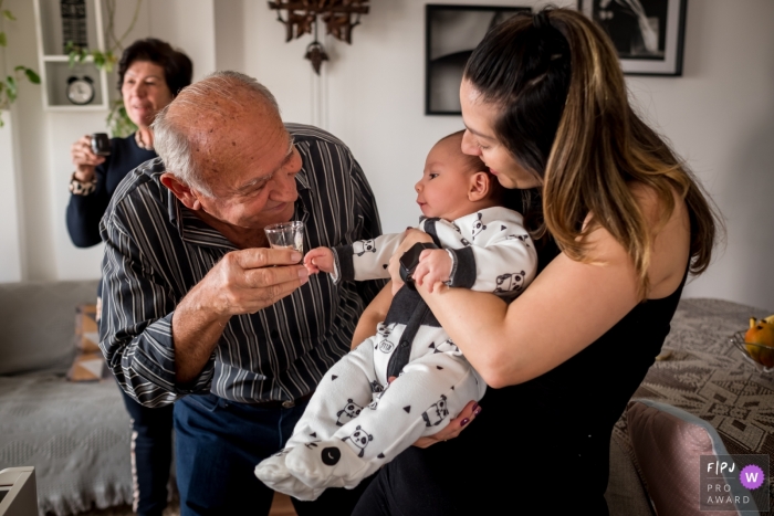 Sao Paulo grandparent all happy while offering an inappropriate drink for the baby during this family photography session Sao Paulo grandparent all happy while offering an inappropriate drink for the baby during this family photography session