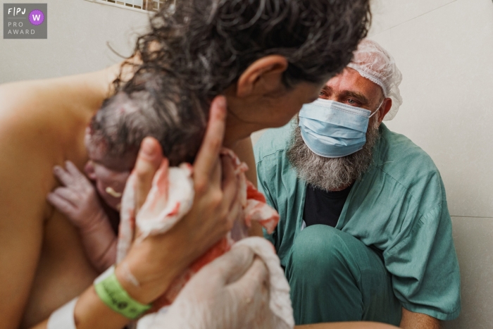 A Sao Paulo documentary birth photographer chronicled dads emotion to see mom and new baby daughter