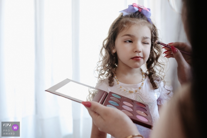 Photo by: <a href="https://www.fpja.com/documentary-family-photography-contests/thiago-braga/florianopolis/2116329">Thiago Braga - Brazil</a> A Santa Catarina documentary family photographer captured this Girl painting her face on her birthday