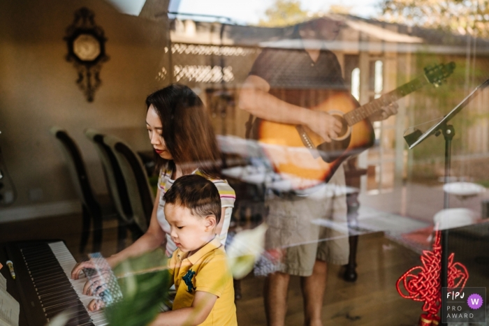 San Jose, California documentary family photography of music time with a piano and guitar in the living room at home