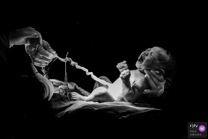 Award winning Rio de Janeiro birth photo at Hospital Plantadores de Cana capturing the pulse of life in BW Award winning Rio de Janeiro birth photo at Hospital Plantadores de Cana capturing the pulse of life in BW