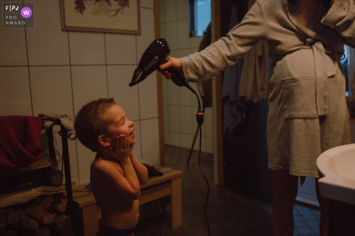 Documentary Tallinn family Day in the Life photography at home showing a moment after bath Documentary Tallinn family Day in the Life photography at home showing a moment after bath