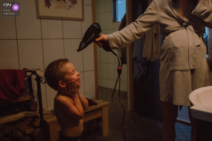 Documentary Tallinn family Day in the Life photography at home showing a moment after bath