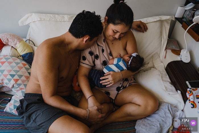 Sao Paulo documentary parents and baby picture of new parents and new baby nursing Sao Paulo documentary parents and baby picture of new parents and new baby nursing