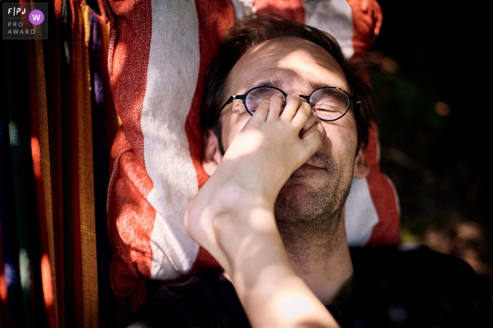 a foot in the middle of a father's face Image from North Rhine-Westphalia showing a foot in the middle of a Bonn father's face