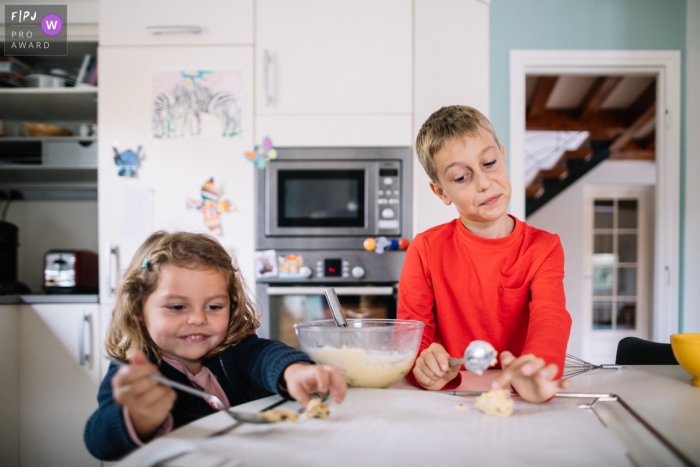 brother and sister making cookies in their kitchen Creative Lyon Brother and sister making cookies in their kitchen in Auvergne-Rhone-Alpes