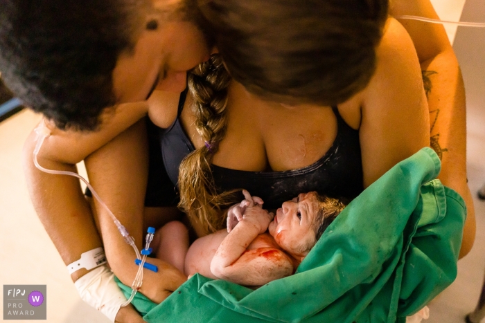 A golden hour took place at Hospital Plantadores de Cana, capturing the precious moments of a newly born infant with their loving mother and father