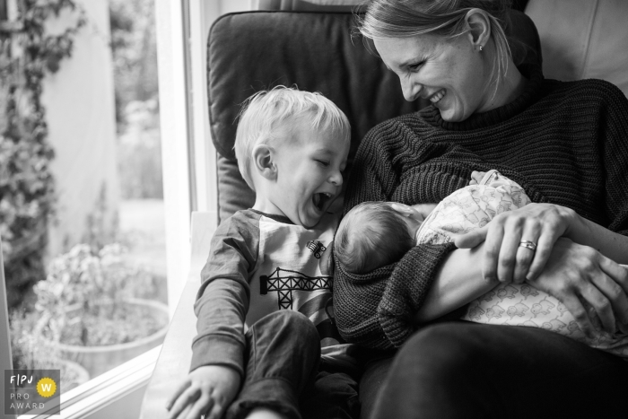 During the documentary photo session, the family bonded and got acquainted with their newest addition, the baby During the documentary family photo session in Bristol, the family had the opportunity to bond and familiarize themselves with their newest addition - the baby